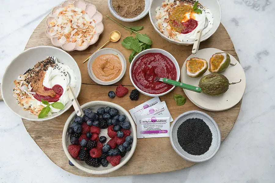 wooden board with all the ingredients for the antioxidant-rich yogurt bowl