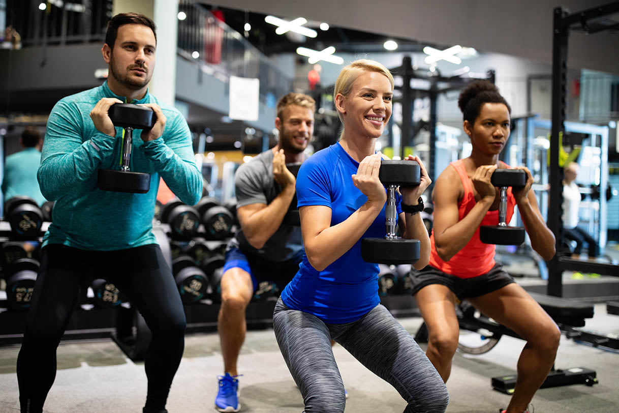 group training with dumbbells, supporting their immune systems with exercise