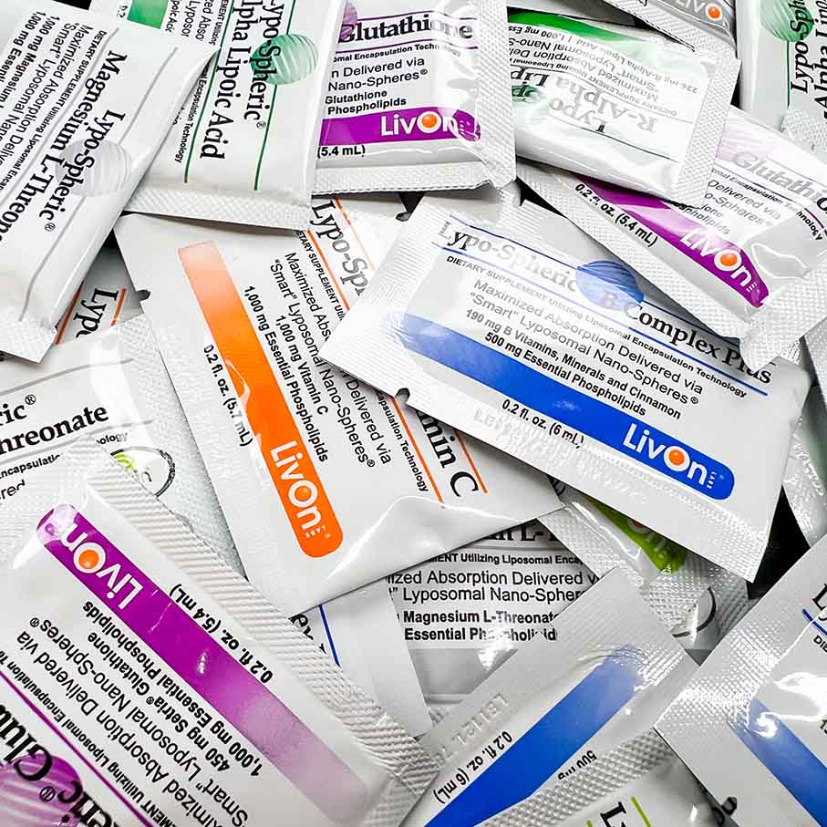 A collection of Lypo-Spheric supplement packets in various colors.