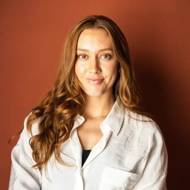photograph of woman in white blouse