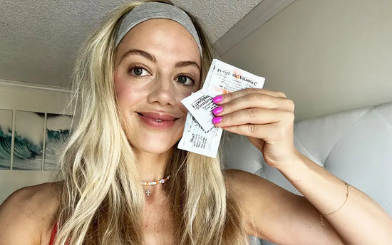 britt turpack holding packets of LYPO C, MAG, and GSH
