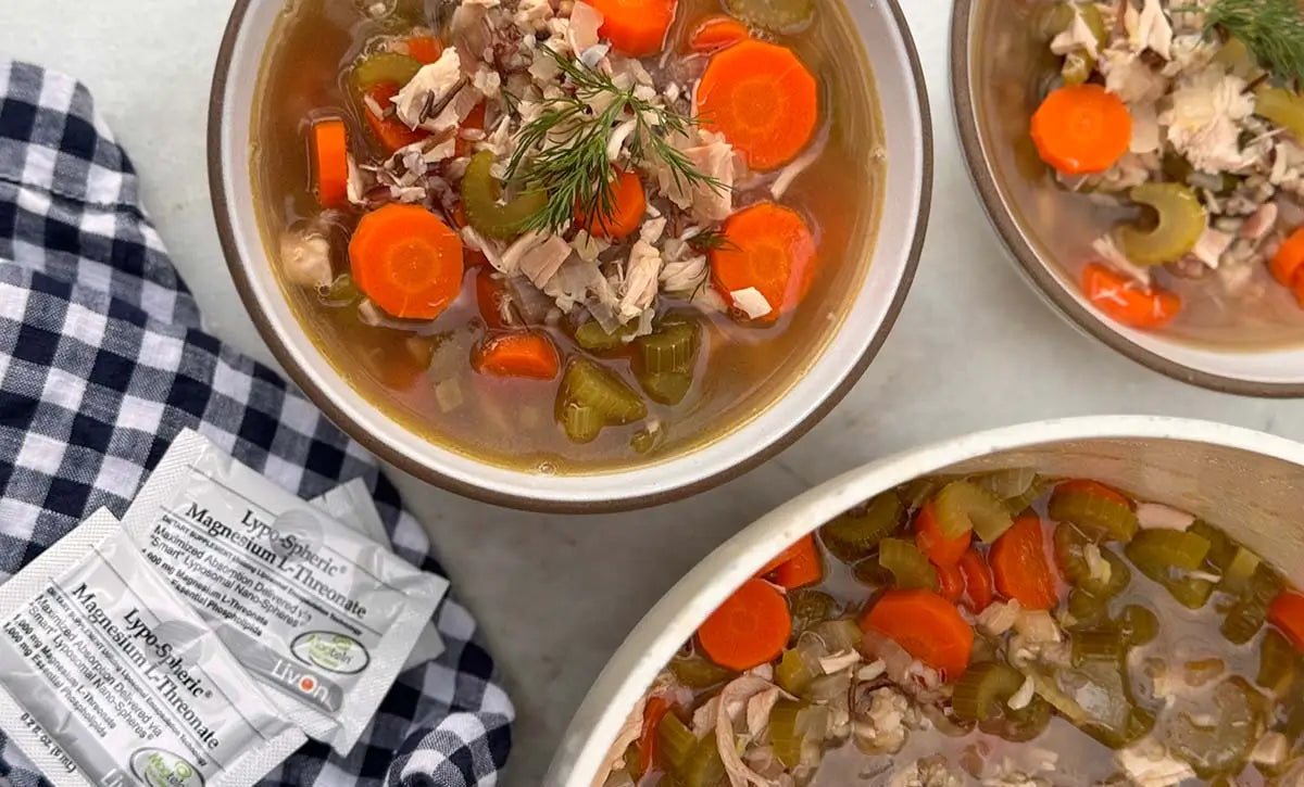 bowls of chicken and wild rice soup with packets of lypo-spheric magnesium
