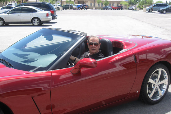 LivOn founder Les Nachman in a red convertible corvette