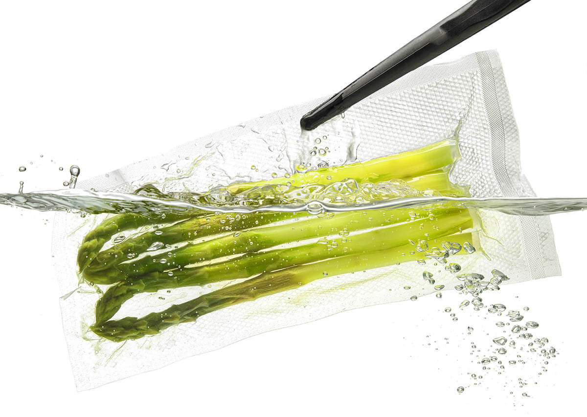 asparagus in a vacuum sealed bag cooked in a low-temperature water bath to minimize nutrient loss during cooking