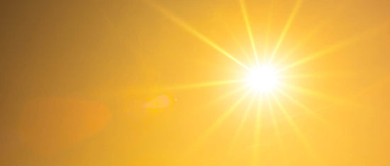 Summer background, orange sky with glowing sun