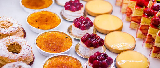 dessert tray containing flan, cake, and more