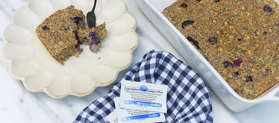 blueberry baked oatmeal on a plate and in baking dish with packets of lypo-spheric b complex plus on a napkin