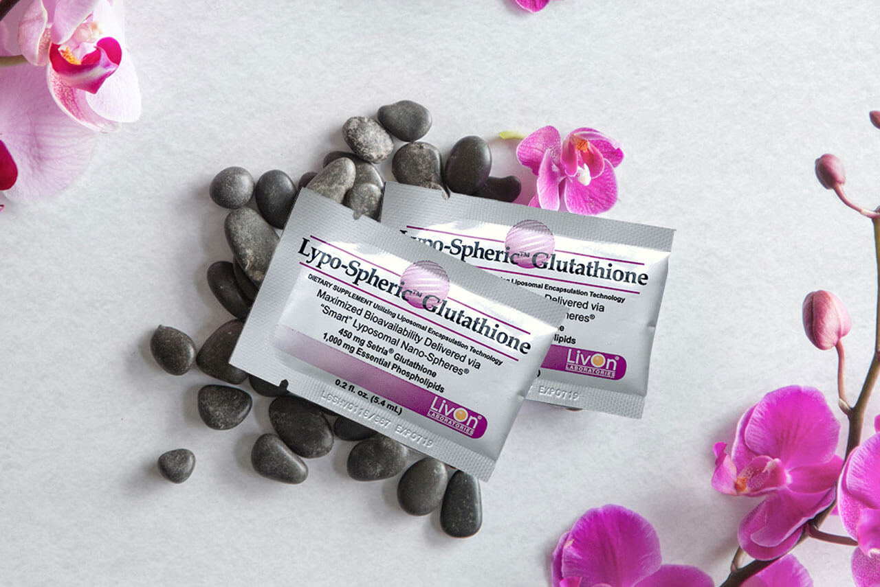 lypo spheric glutathione packets with rocks and flowers