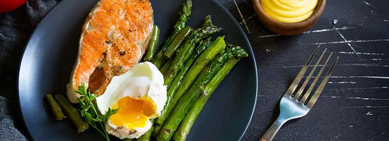 plate of salmon, eggs, and asparagus