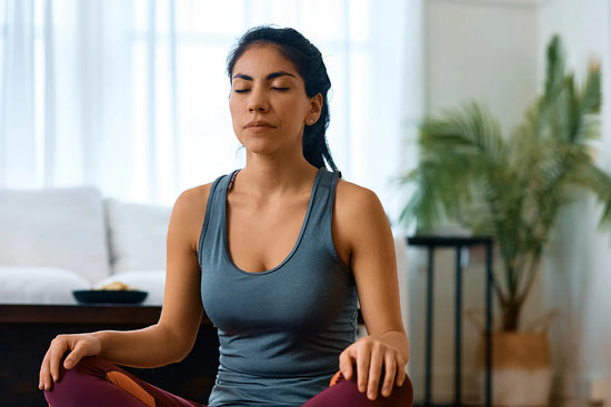 athletic woman meditating with eyes closed